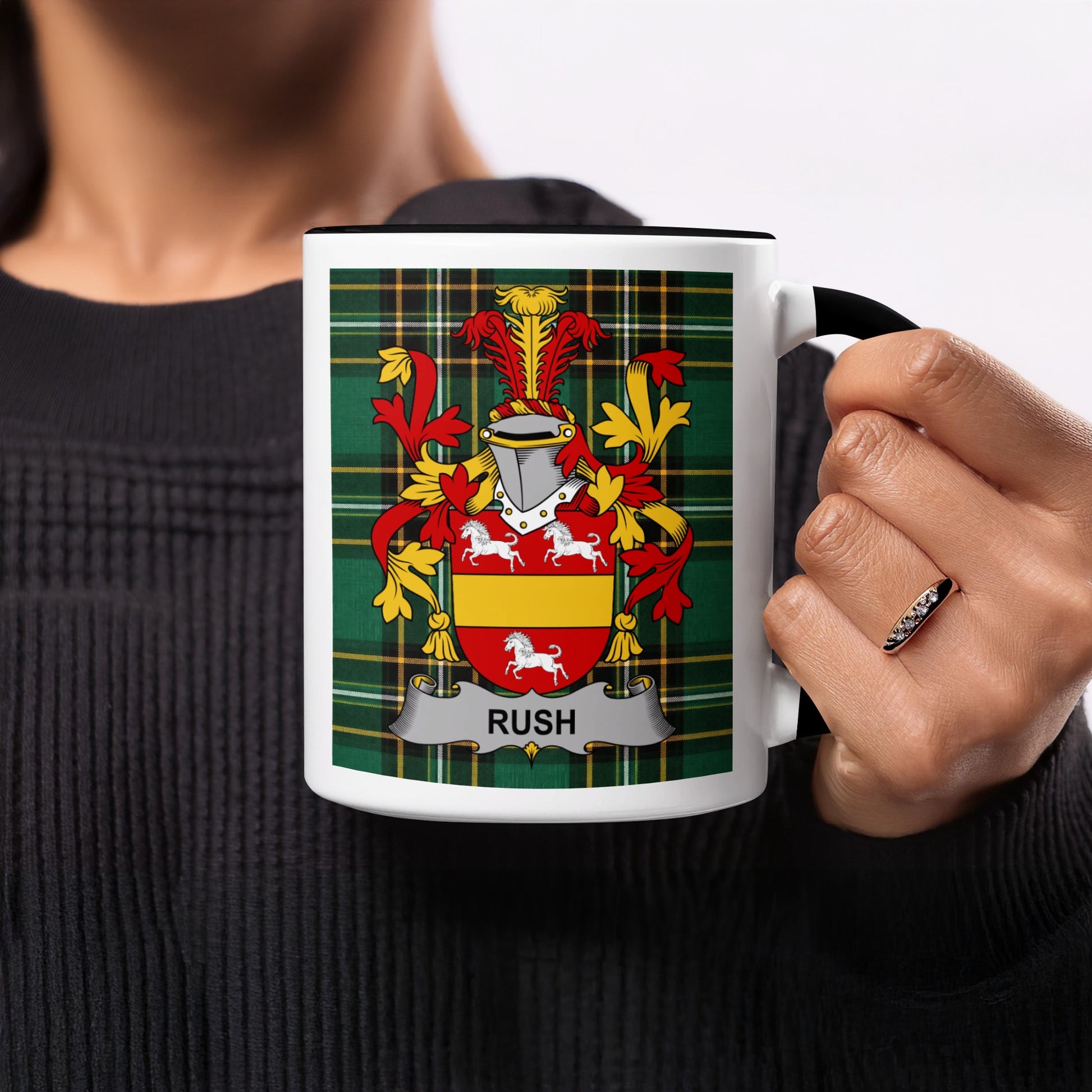 White mug with the Rush family crest and tartan pattern.