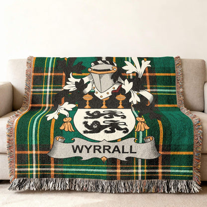 Wyrrall family crest on a green tartan woven throw blanket.