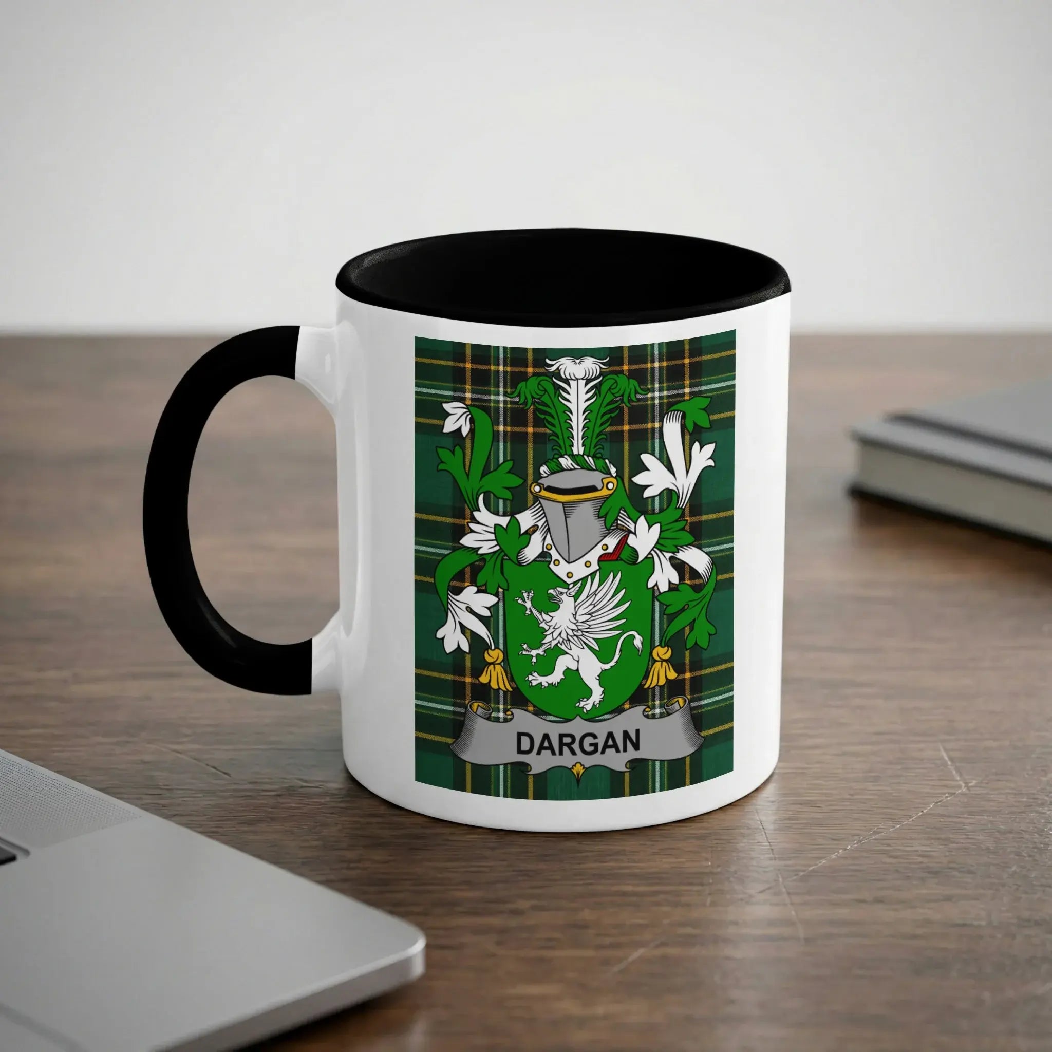 White mug with black handle featuring a green plaid coat of arms with "DARGAN" banner.