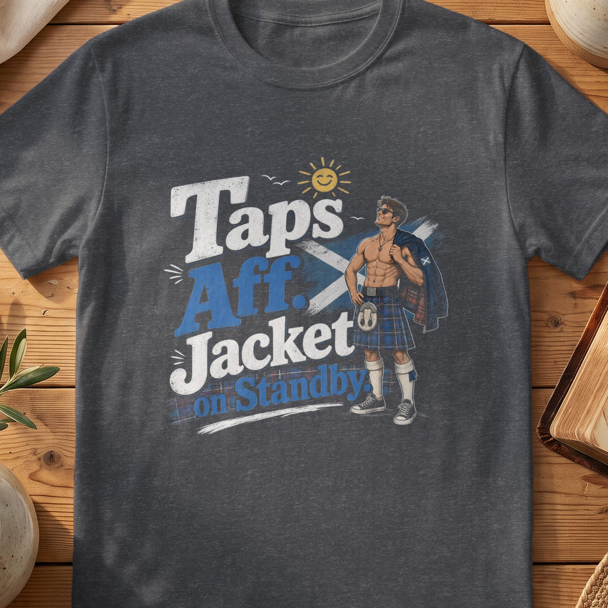 Dark grey Gildan 64000 unisex T-shirt flatlay with Taps Aff Jacket on Standby Scottish graphic design