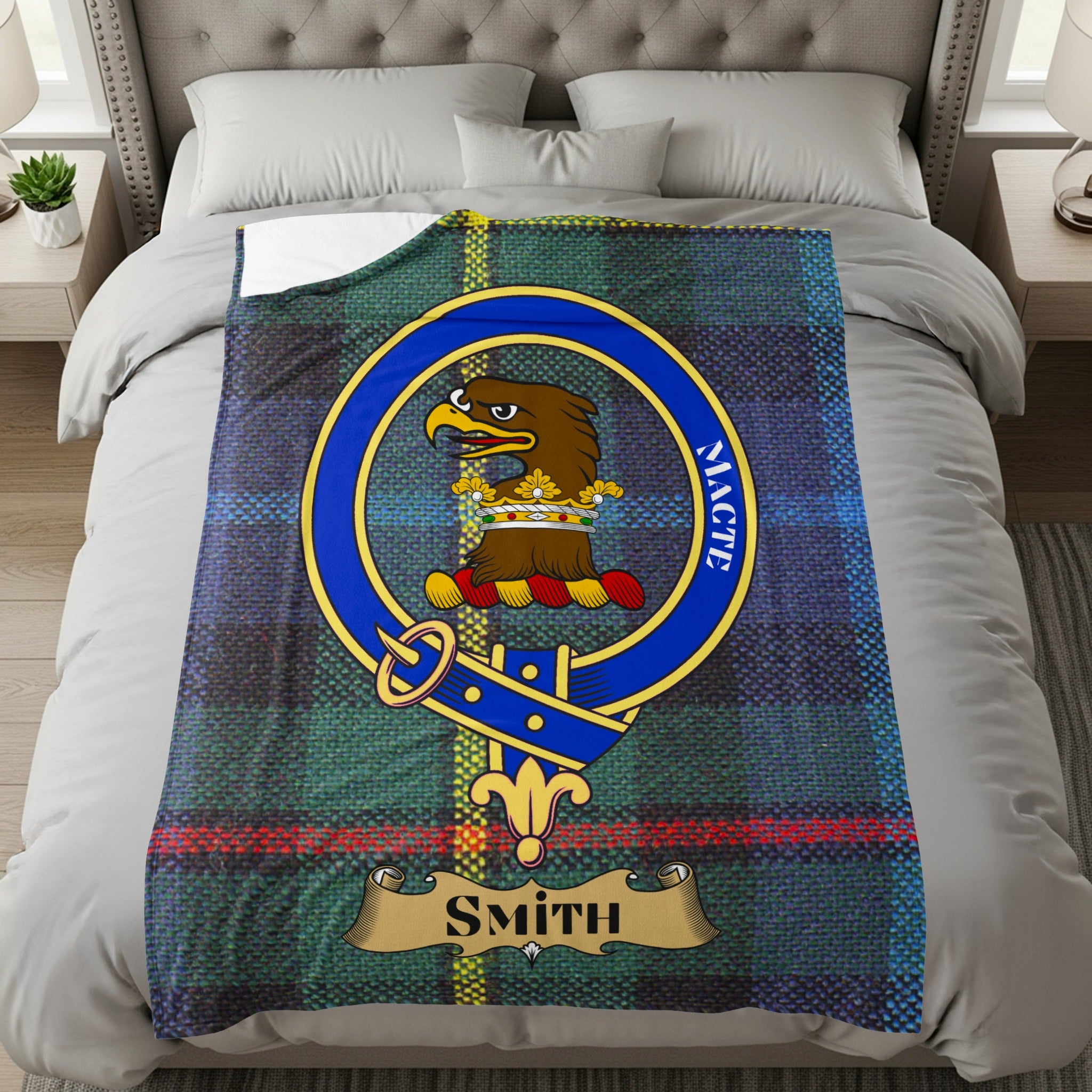 Smith clan crest with eagle and Macte motto on tartan throw