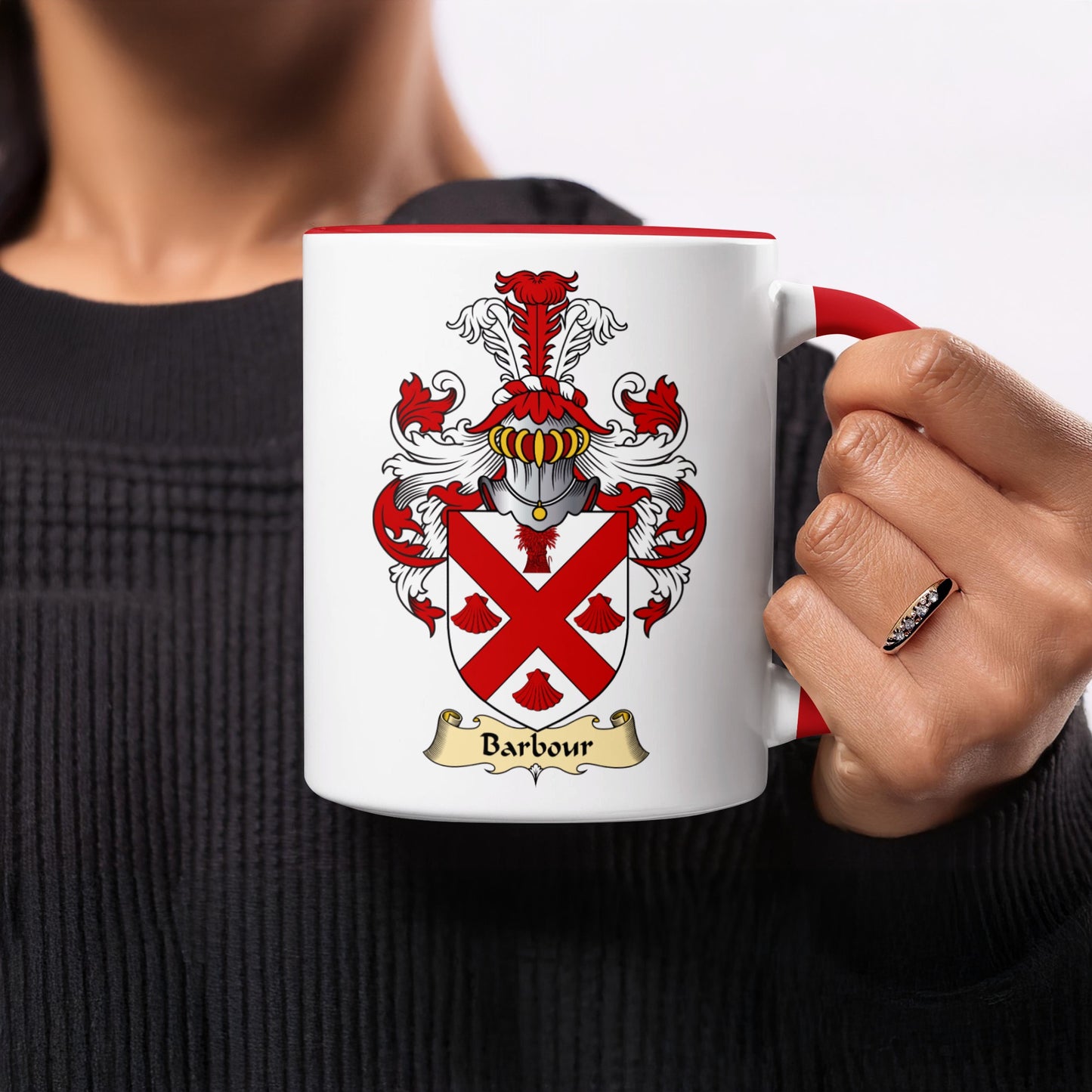 White mug with red handle, featuring a crest with the name "Barbour".