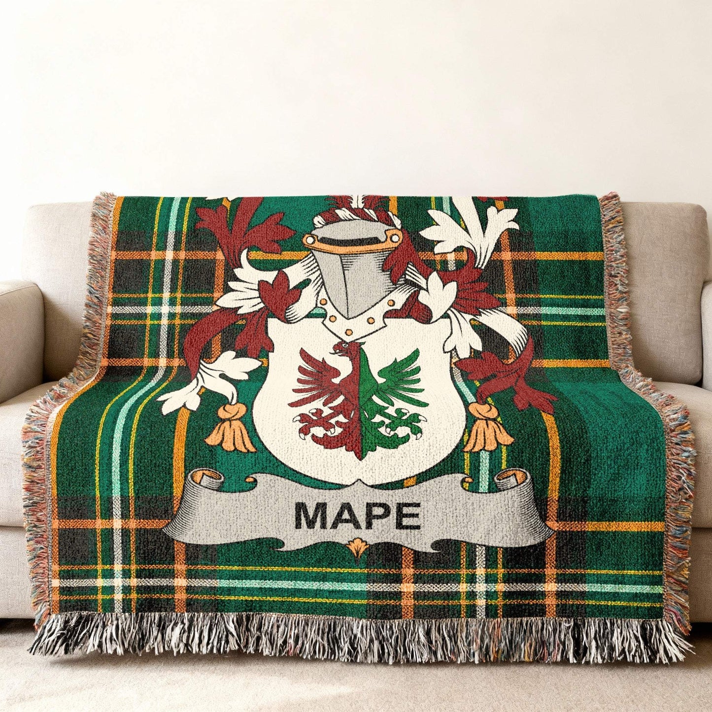 Green plaid throw blanket featuring the "MAPE" family crest.
