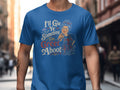 Blue t-shirt with graphic of a woman and Scottish thistles, saying "I'll Gie Ye Something Tae Greet Aboot".
