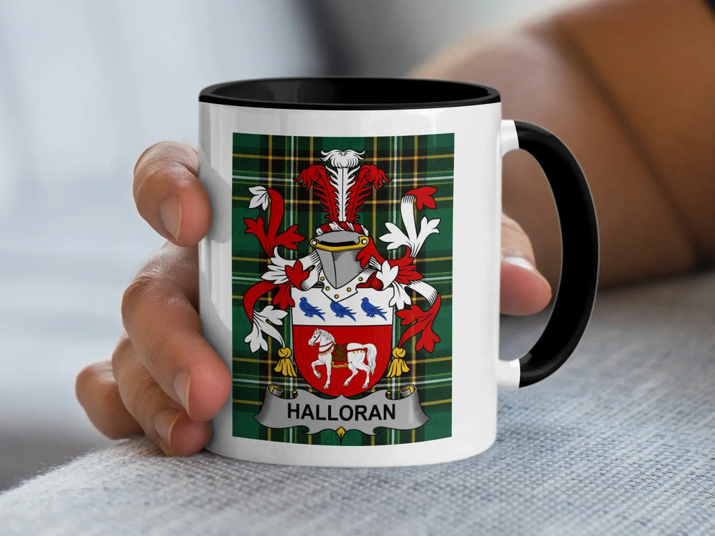 White mug with black handle featuring Halloran family crest on plaid background.
