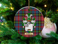 Raeburn Scottish clan ceramic ornament with family crest on a Caledonia tartan background, hanging on a Christmas tree