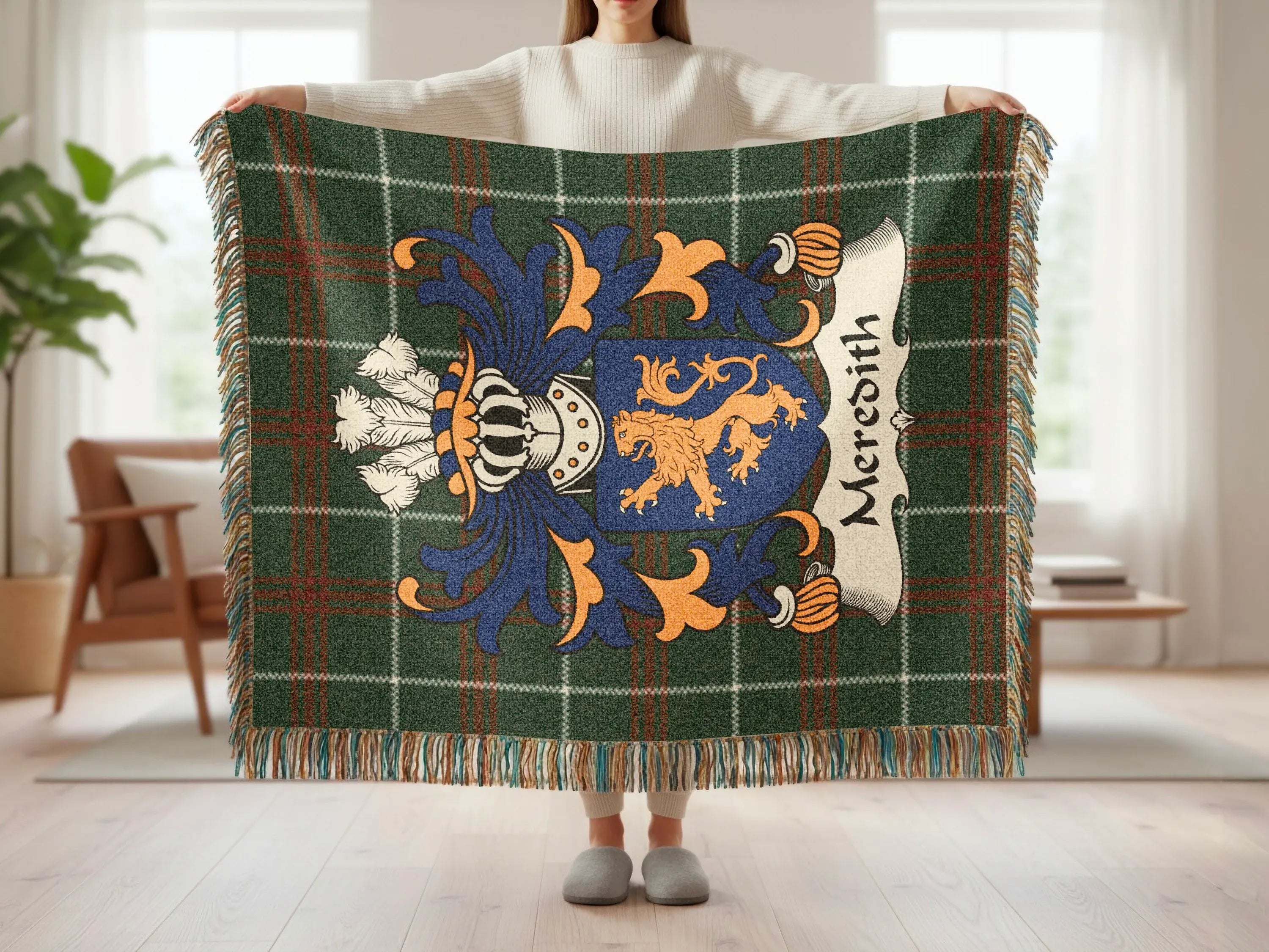 Meredith tartan blanket featuring a blue and gold crest with a lion.