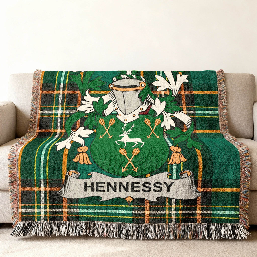 Green tartan blanket featuring the Hennessy family crest with a deer.