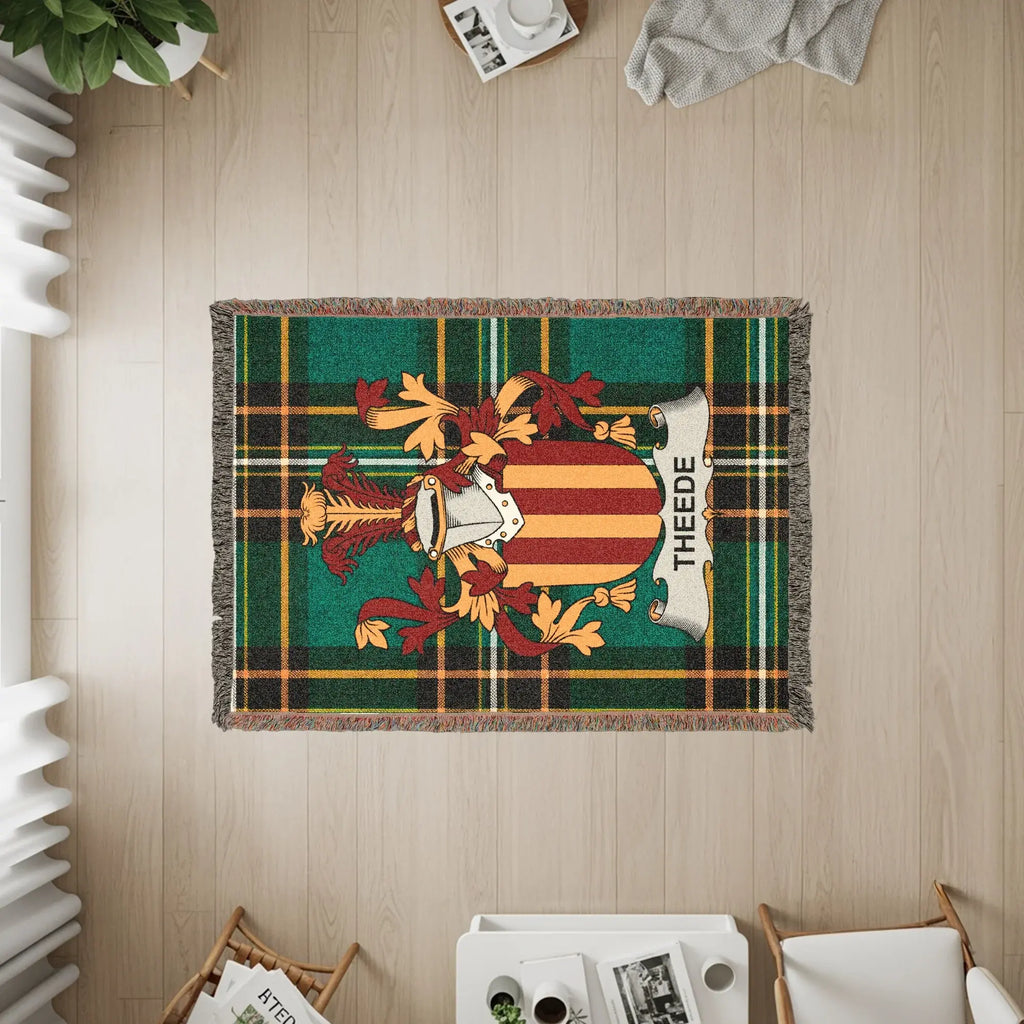 Woven throw blanket with a Scottish tartan pattern and a family crest with the name "THEEDE".