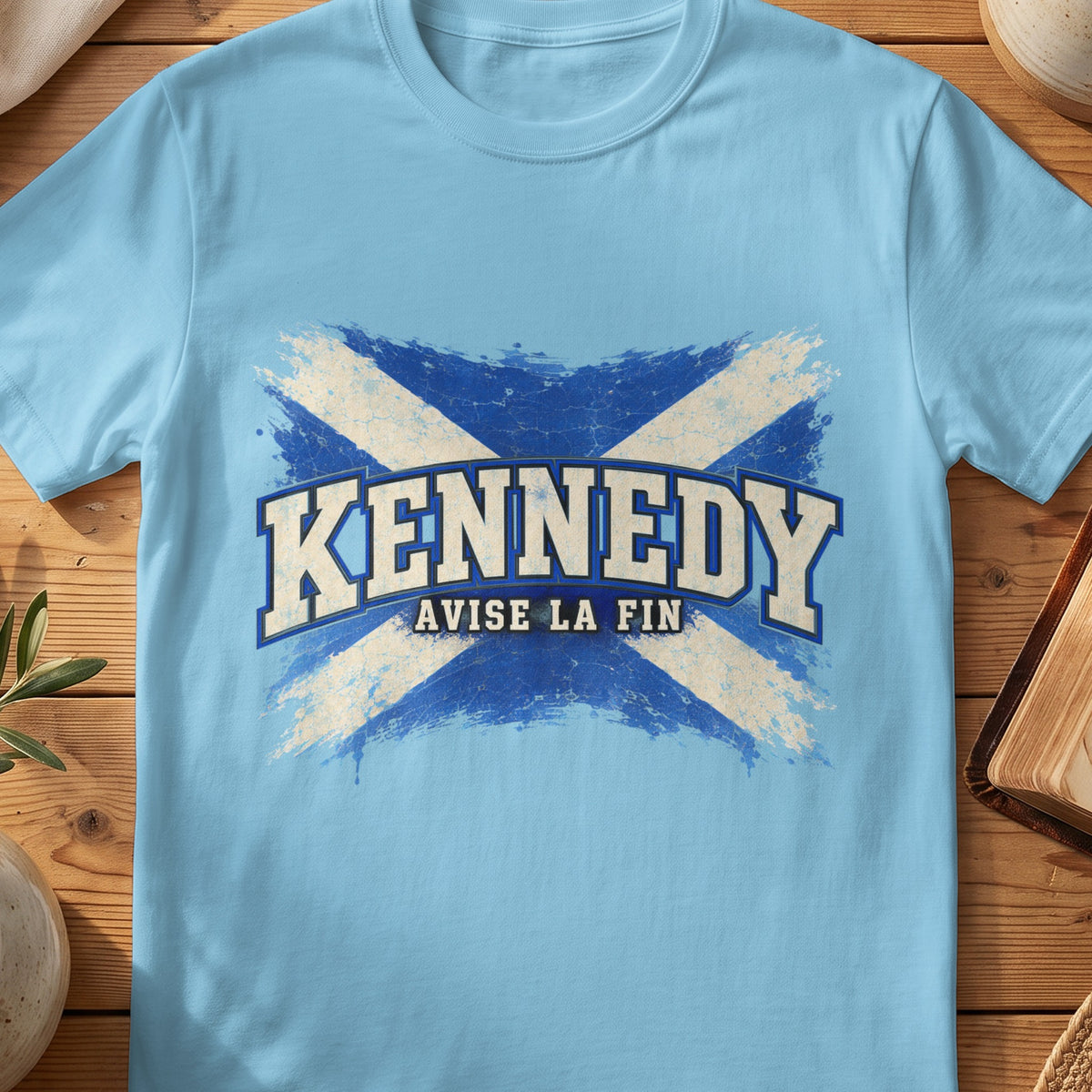 Kennedy Scottish Saltire T-shirt in Sky, with distressed blue and cream flag and “Avise La Fin” lettering.