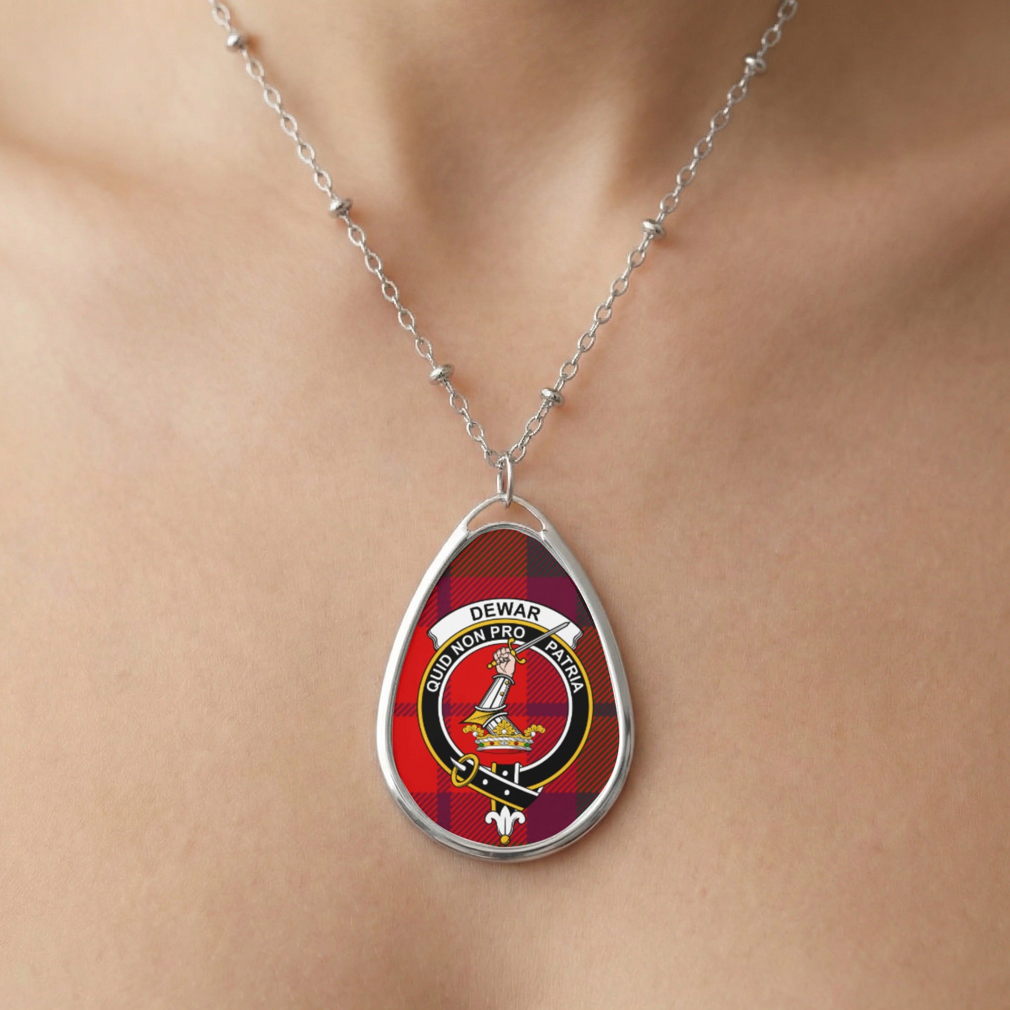 Close-up of Dewar clan tartan pendant necklace with crest design