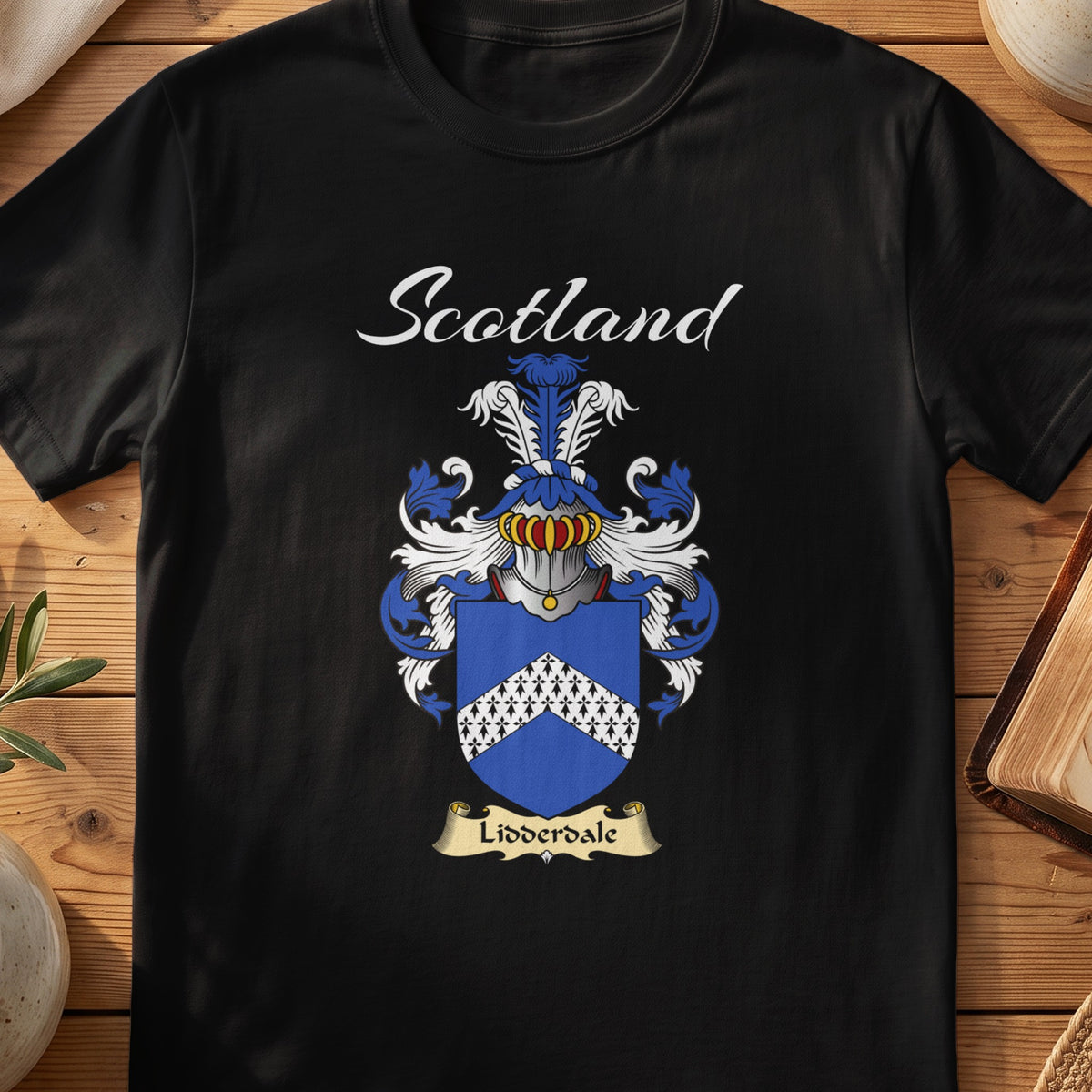 Black Lidderdale Scottish T-shirt featuring a white patterned chevron on blue