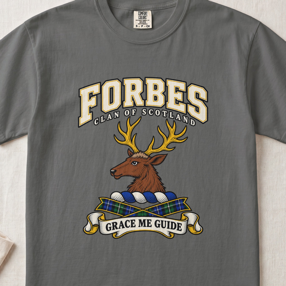 Forbes graphic T-shirt in Pepper gray, front flat lay showing varsity lettering and brown stag head with gold antlers.