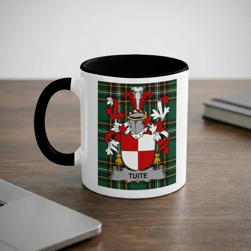 White mug with black handle featuring the Tuite family crest on a green tartan background.