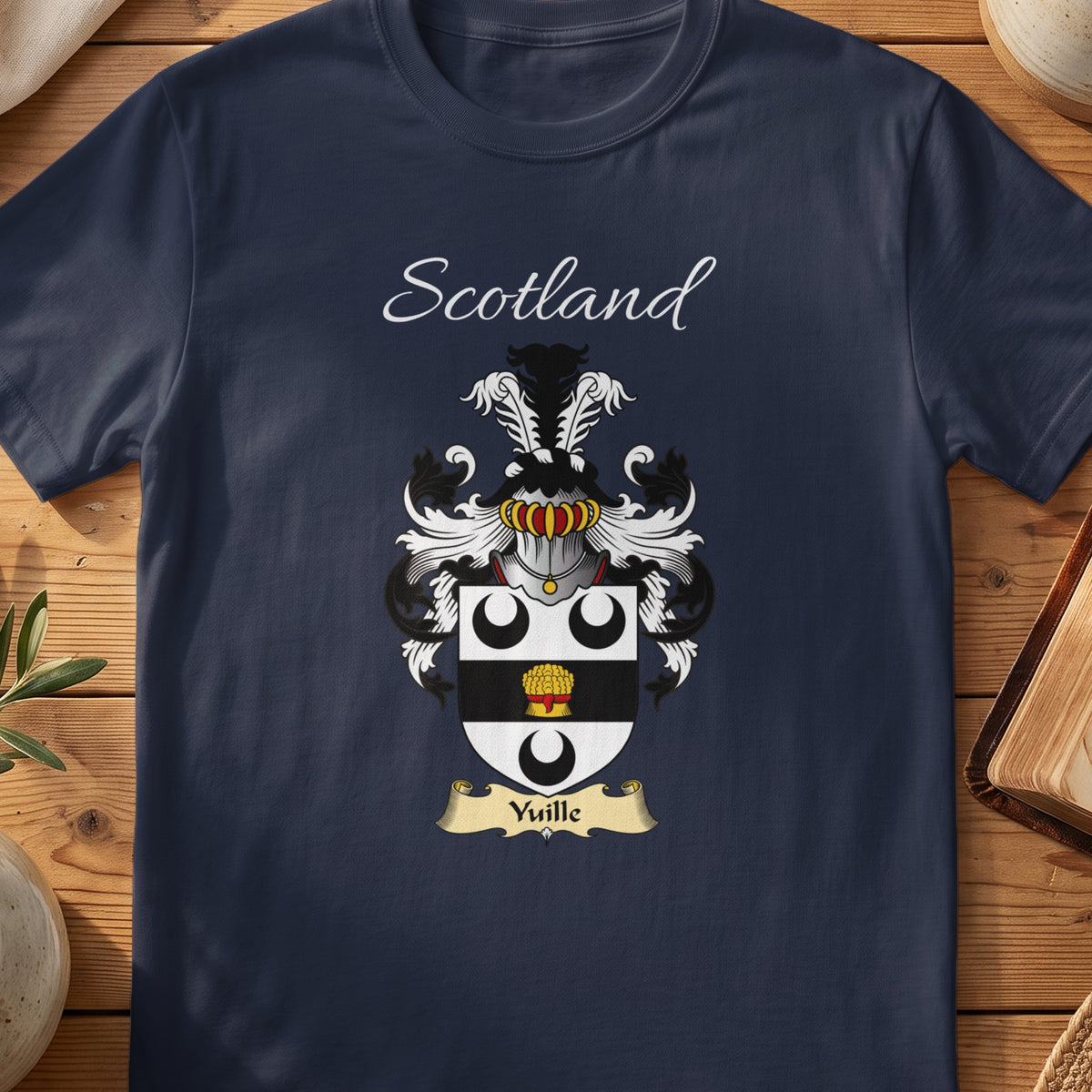 Navy Yuille heritage T-shirt laid flat with “Scotland” and the colourful family shield design.