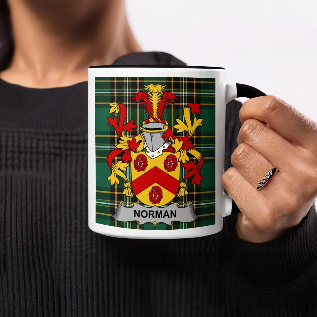 Mug featuring the Norman coat of arms against a green tartan background.