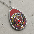 Dennistoun clan Scottish tartan necklace with clan crest on tartan background