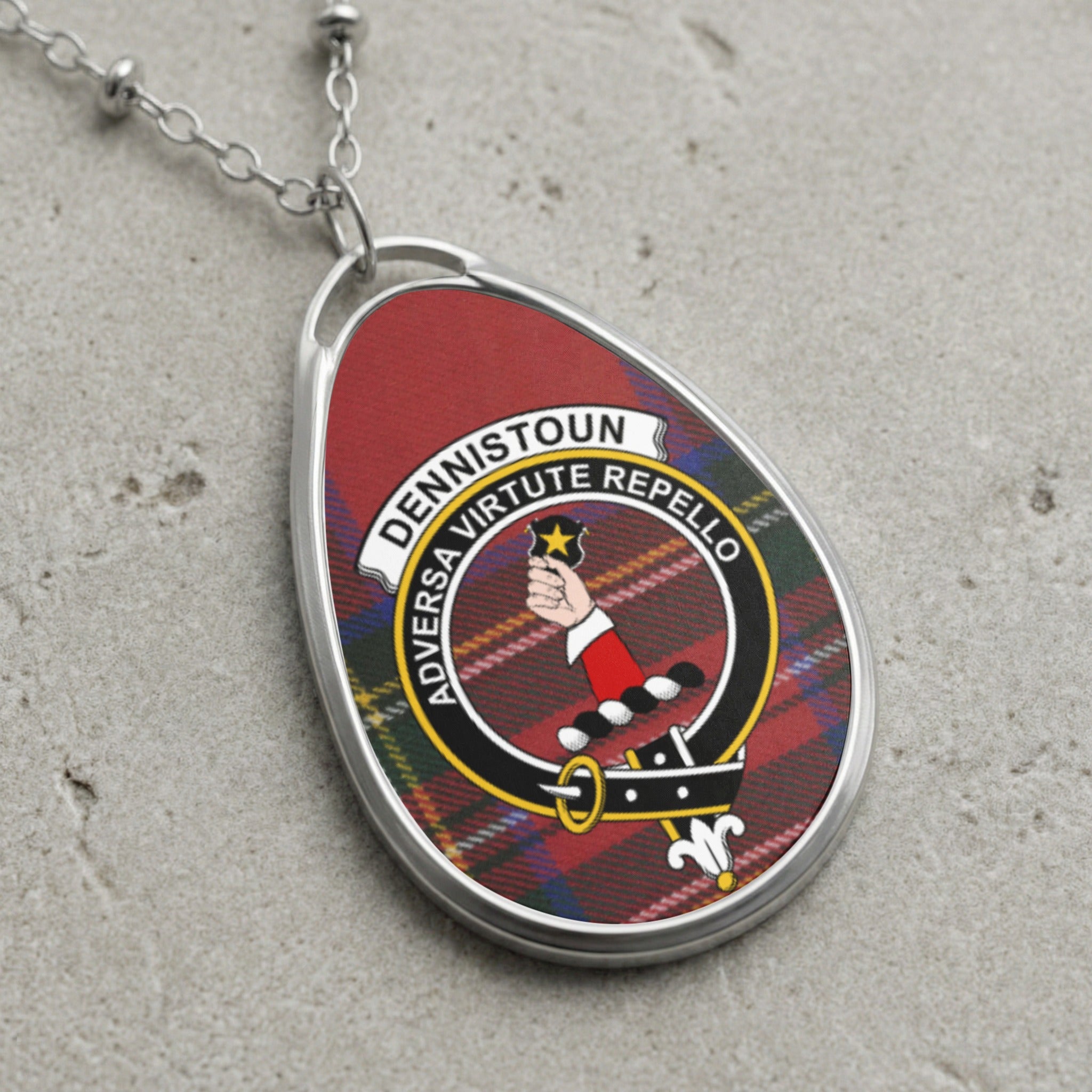 Dennistoun clan Scottish tartan necklace with clan crest on tartan background