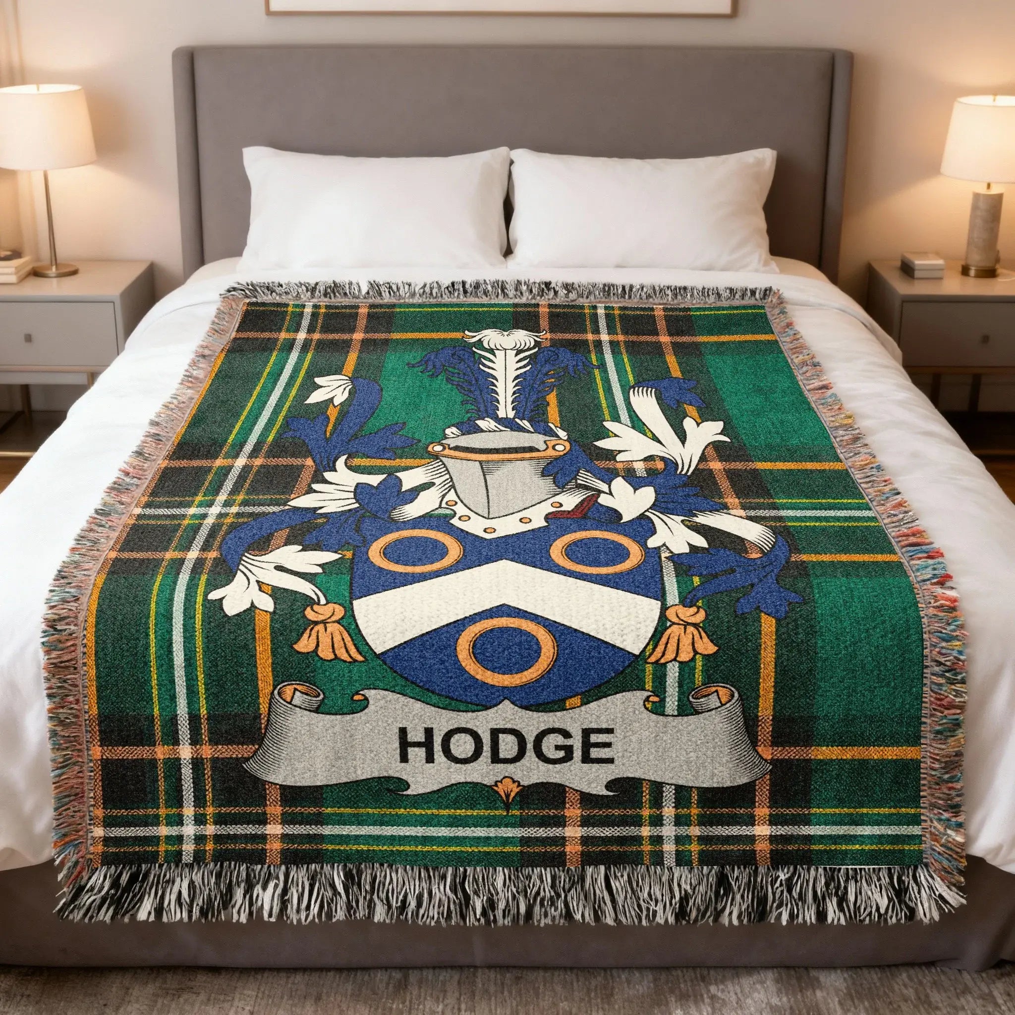Tartan blanket with the Hodge family crest displayed prominently.