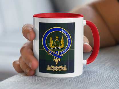 Johnson clan crest on a red-handled mug.
