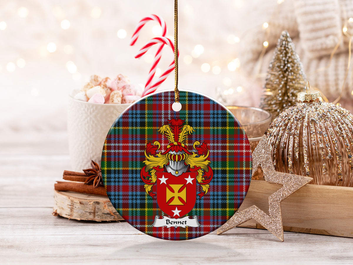 Bennet family emblem ceramic Christmas ornament with Caledonia tartan background in festive holiday décor