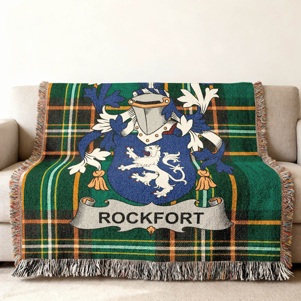 Woven throw blanket with green tartan plaid and the Rockfort family crest.