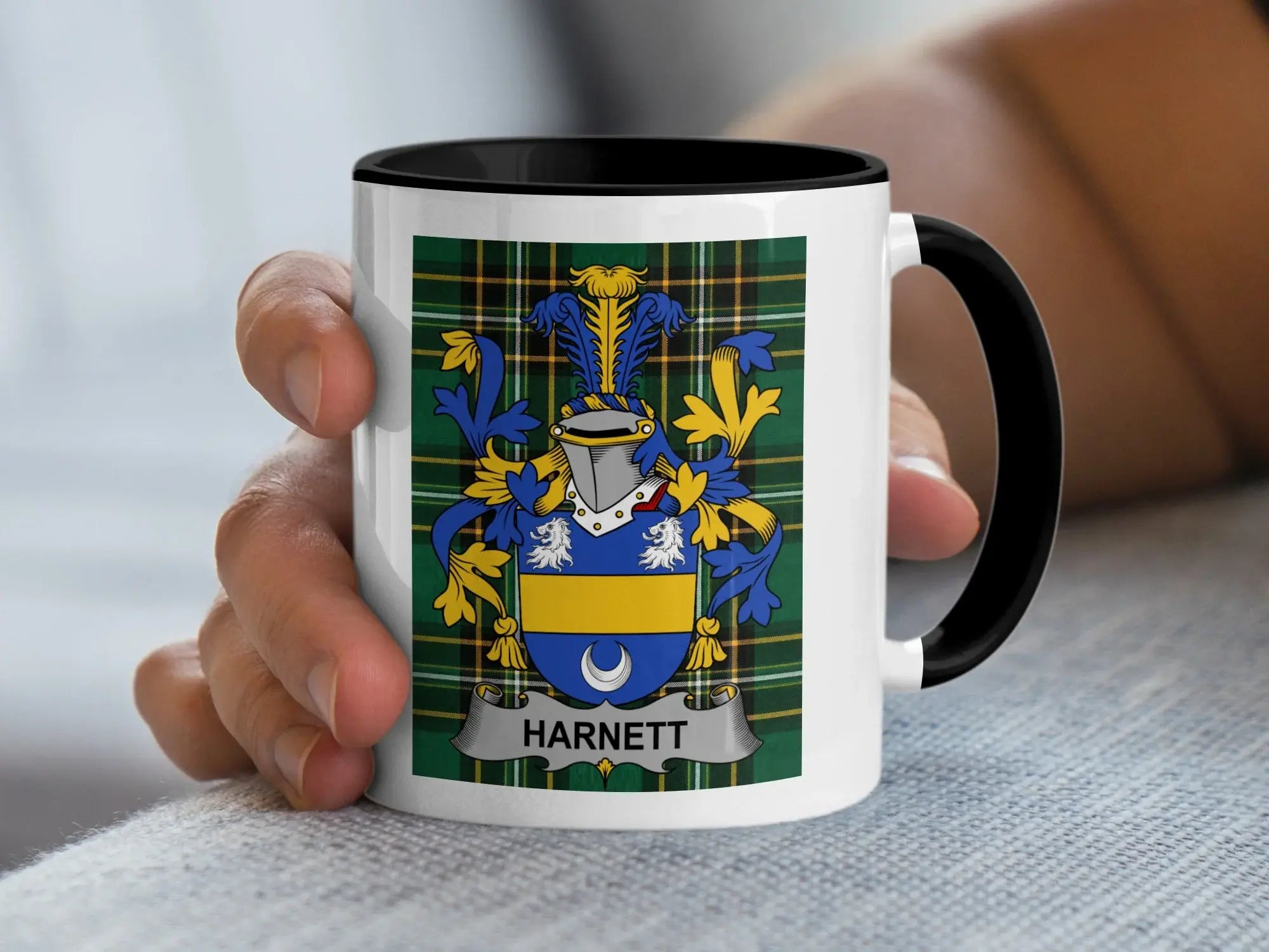 White mug with black rim featuring a family crest with the name "HARNETT".