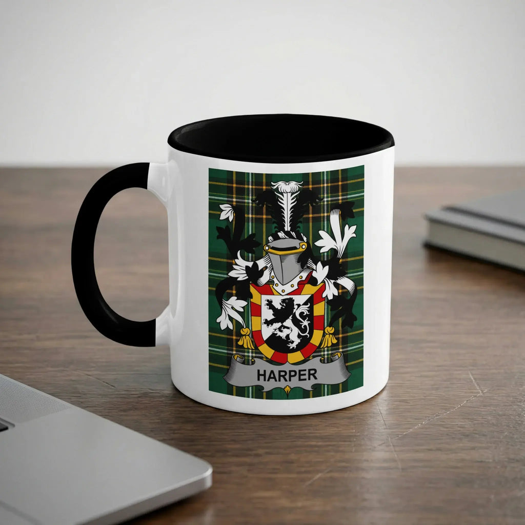 White mug with black rim and handle featuring the Harper family crest.