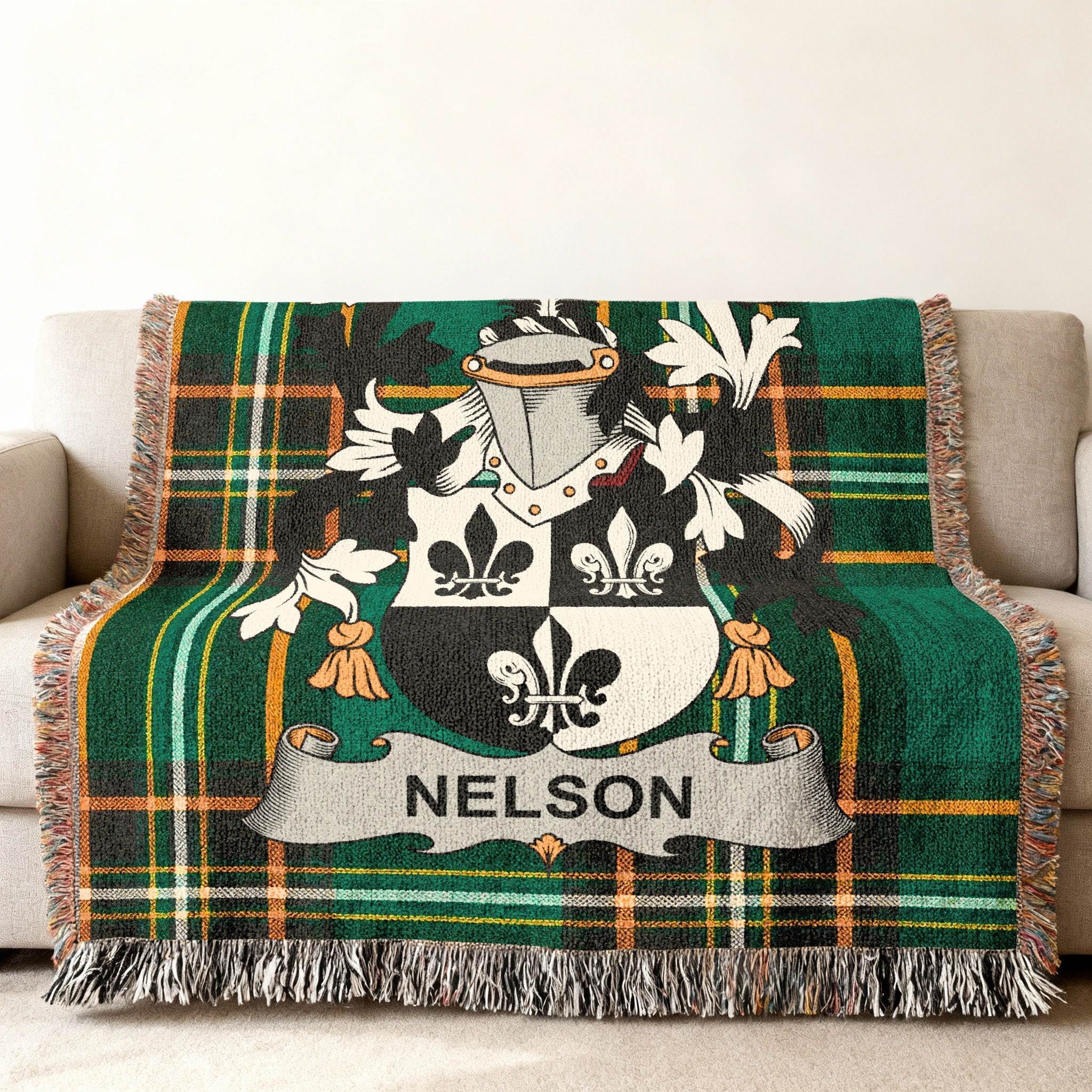 Nelson family crest on a green tartan throw blanket.