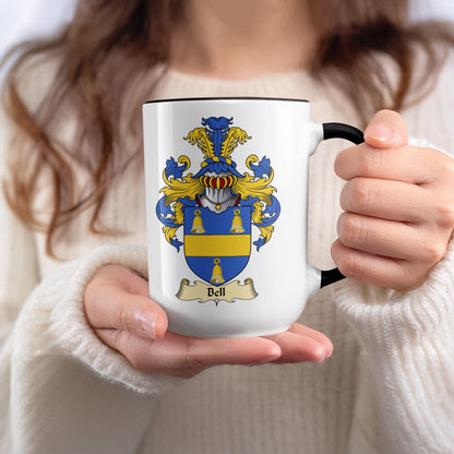 White mug with black rim featuring the Bell family crest.