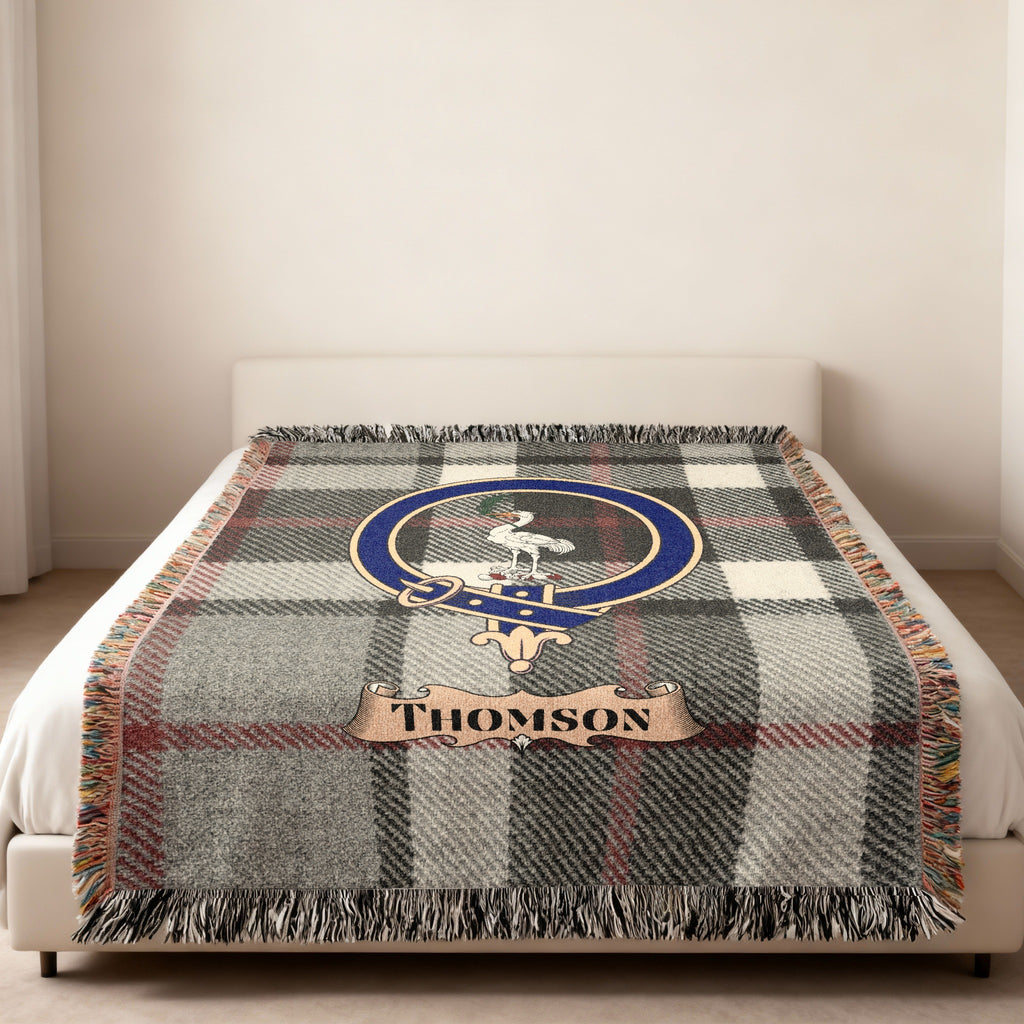 Thomson family crest and name on grey tartan woven blanket