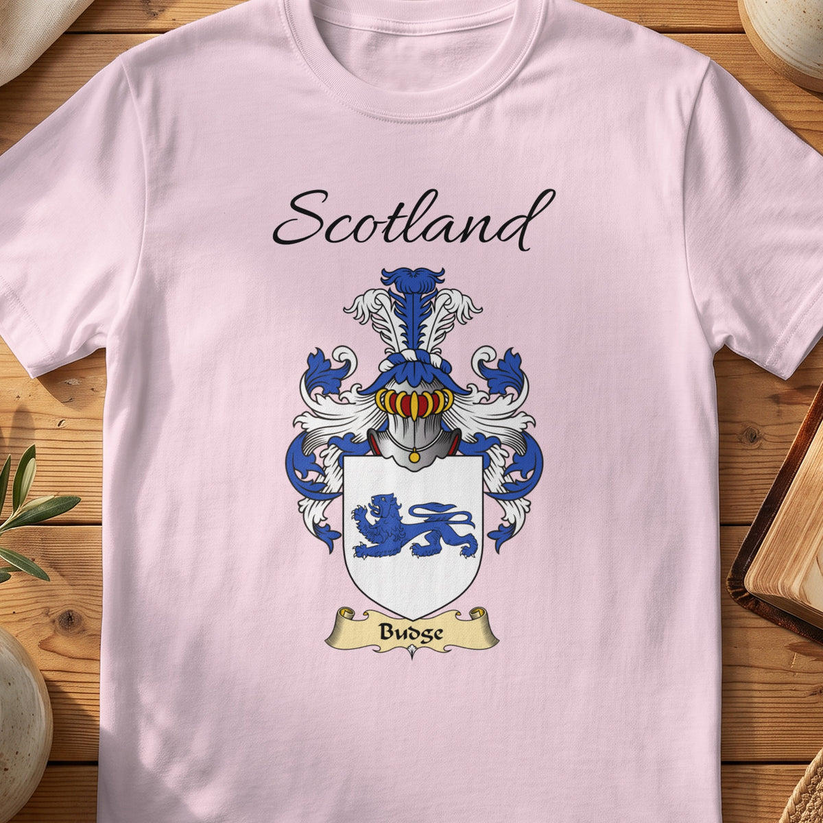 Light Pink Budge Scottish family shield T-shirt featuring a blue lion on a white shield