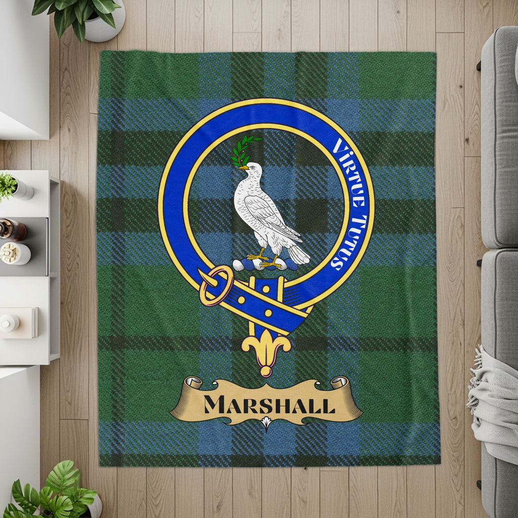 Marshall crest with dove and Virtute Tutus motto on tartan throw — detail