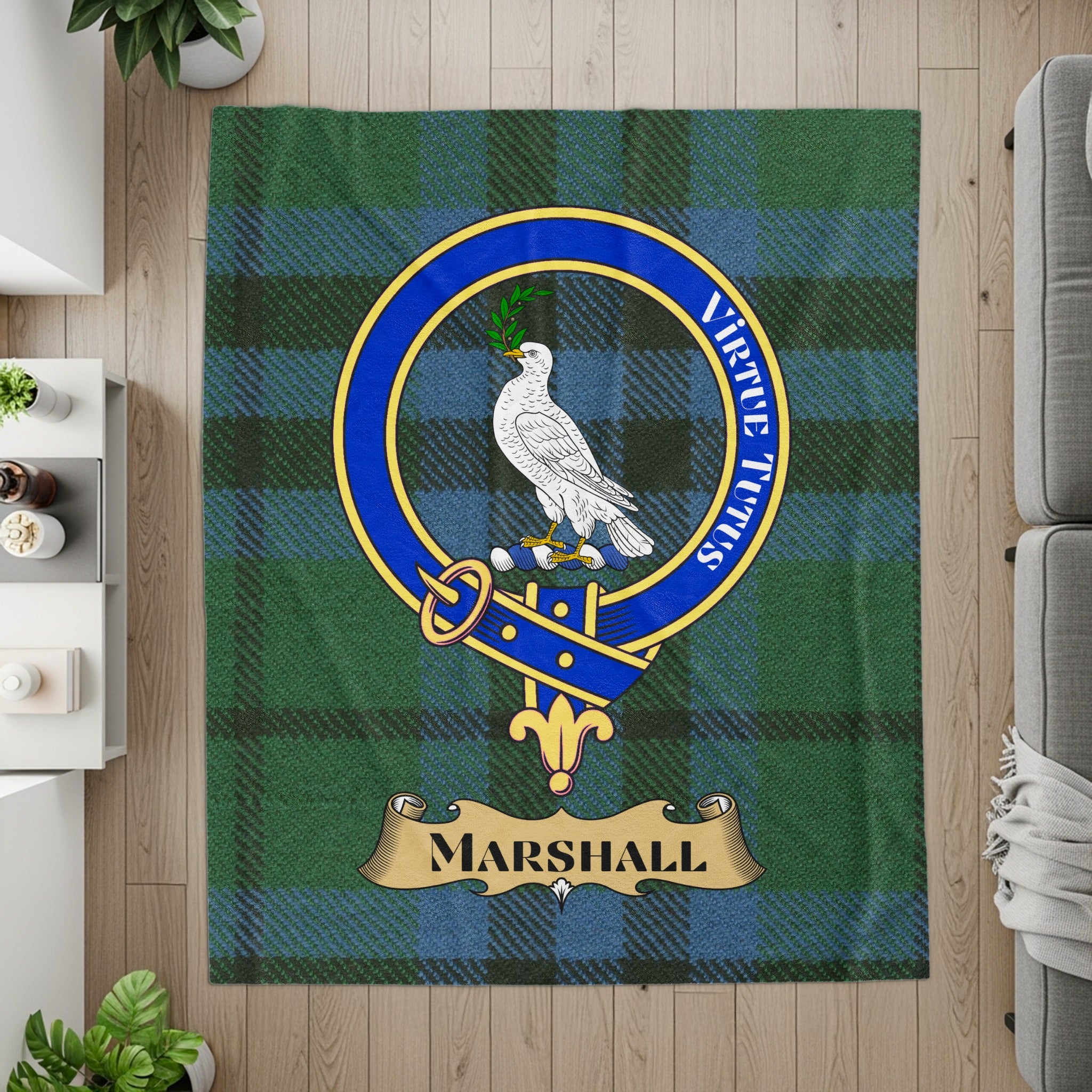 Marshall crest with dove and Virtute Tutus motto on tartan throw — detail