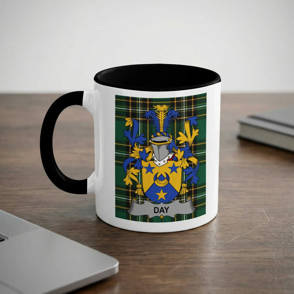 White mug with black handle featuring the Day family crest on a tartan background.