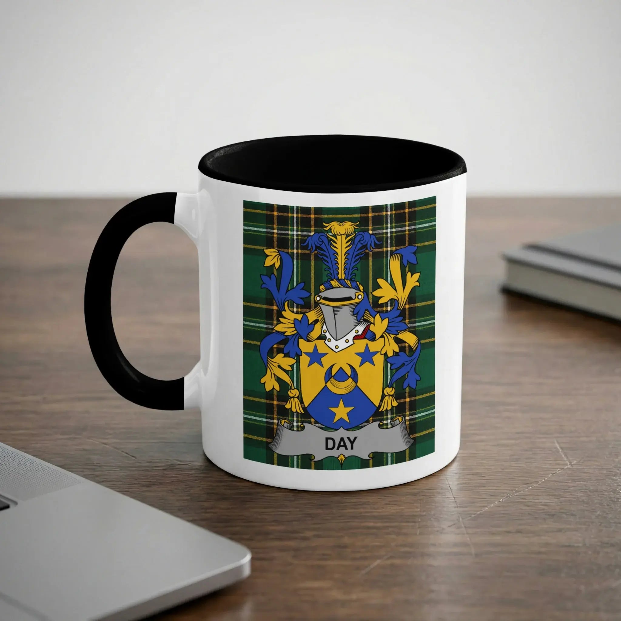 White mug with black handle featuring the Day family crest on a tartan background.