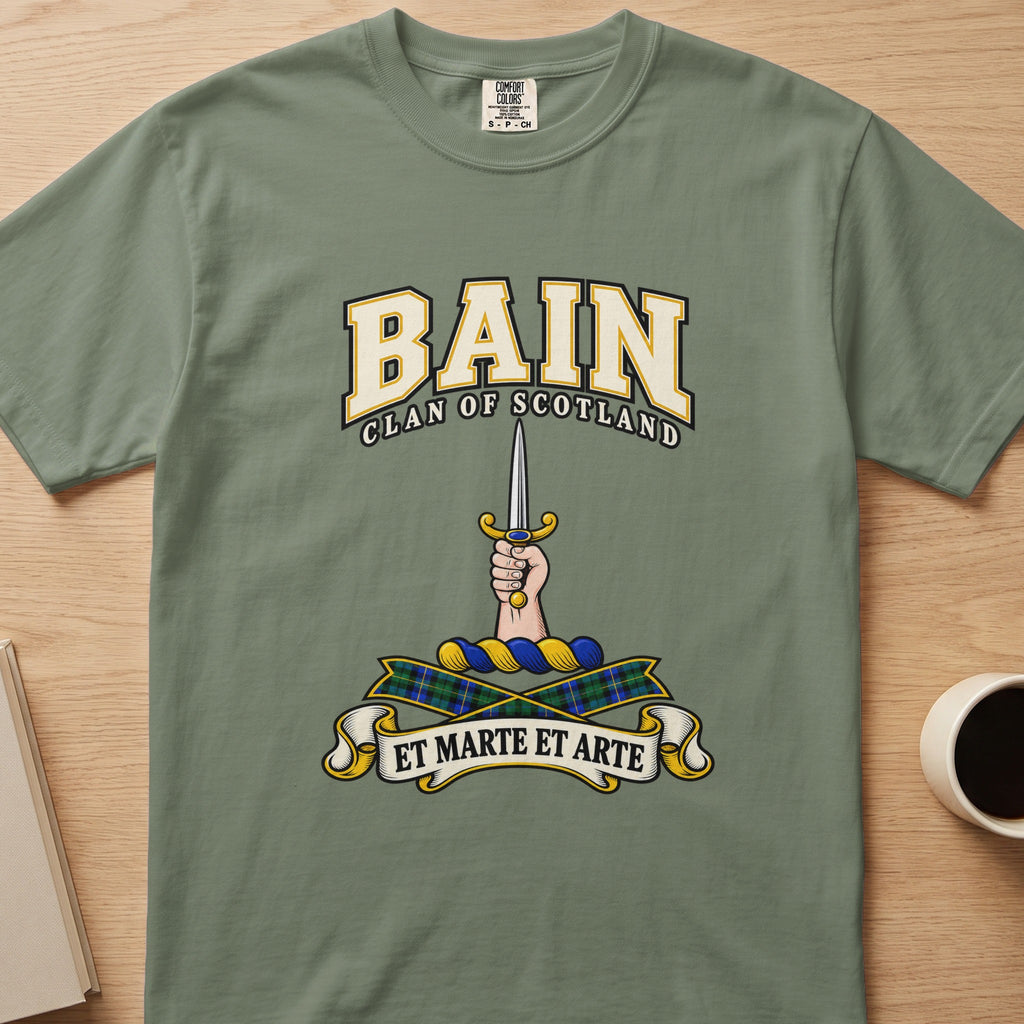 Bain clan T-shirt in sage green, front view with hand holding a slim upright sword