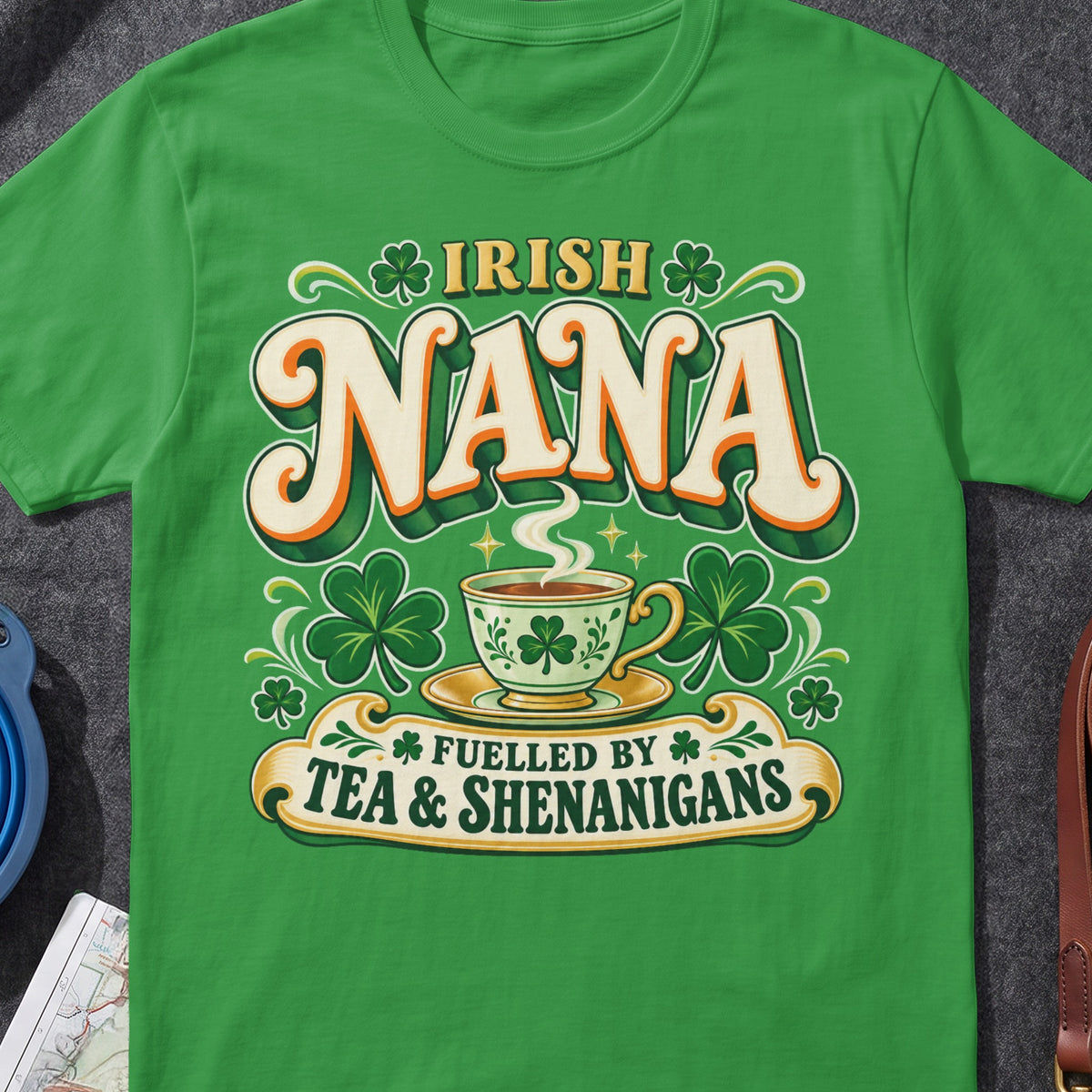 Irish Nana Fuelled by Tea & Shenanigans funny Irish T-shirt in Irish Green, flat-lay mockup