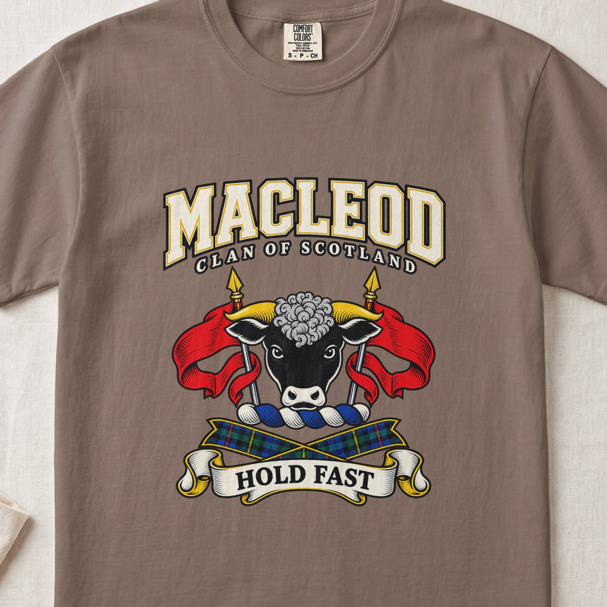 MacLeod graphic T-shirt in Espresso brown, front flat lay showing varsity lettering and black bull head with gold horns and white forehead curls.