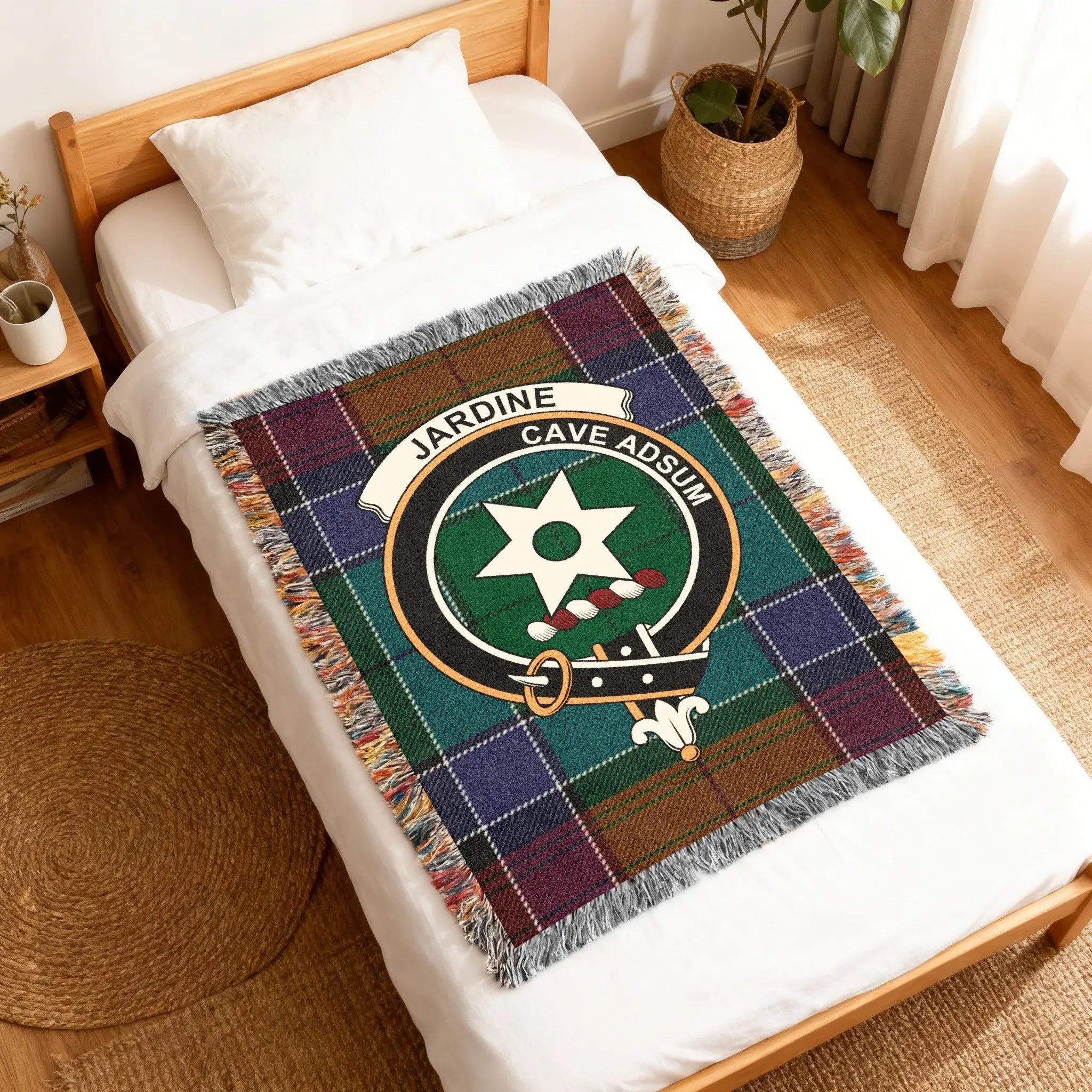 Clan Jardine tartan woven blanket — fringe border detail showing woven pattern and clan crest