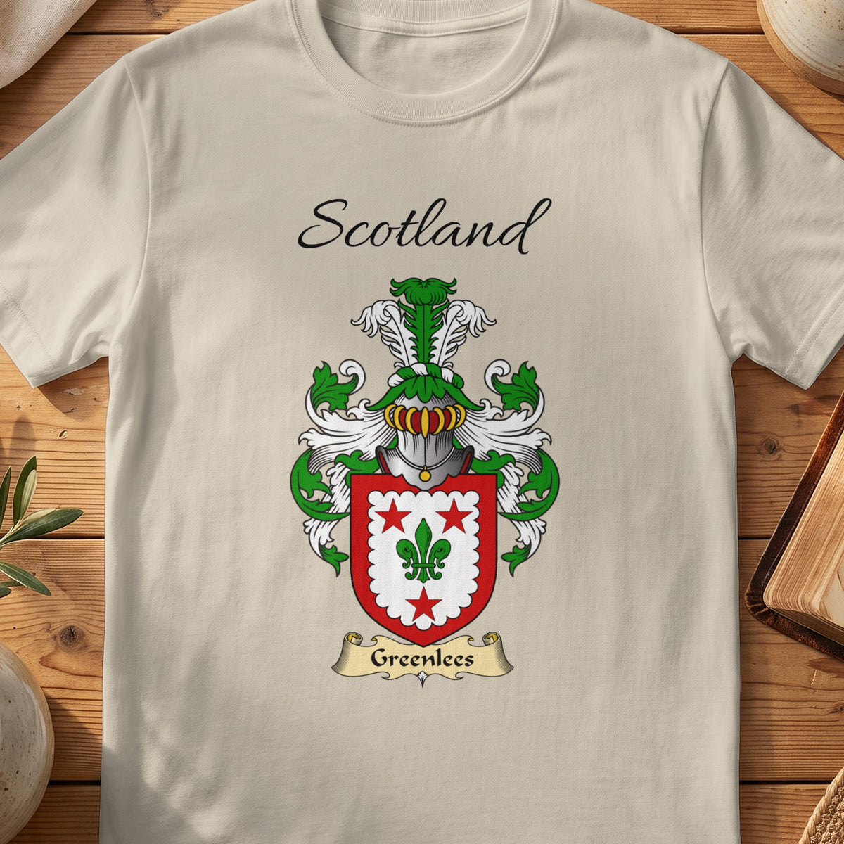 Sand Greenlees Scottish family shield T-shirt featuring a green fleur-de-lis within a red border