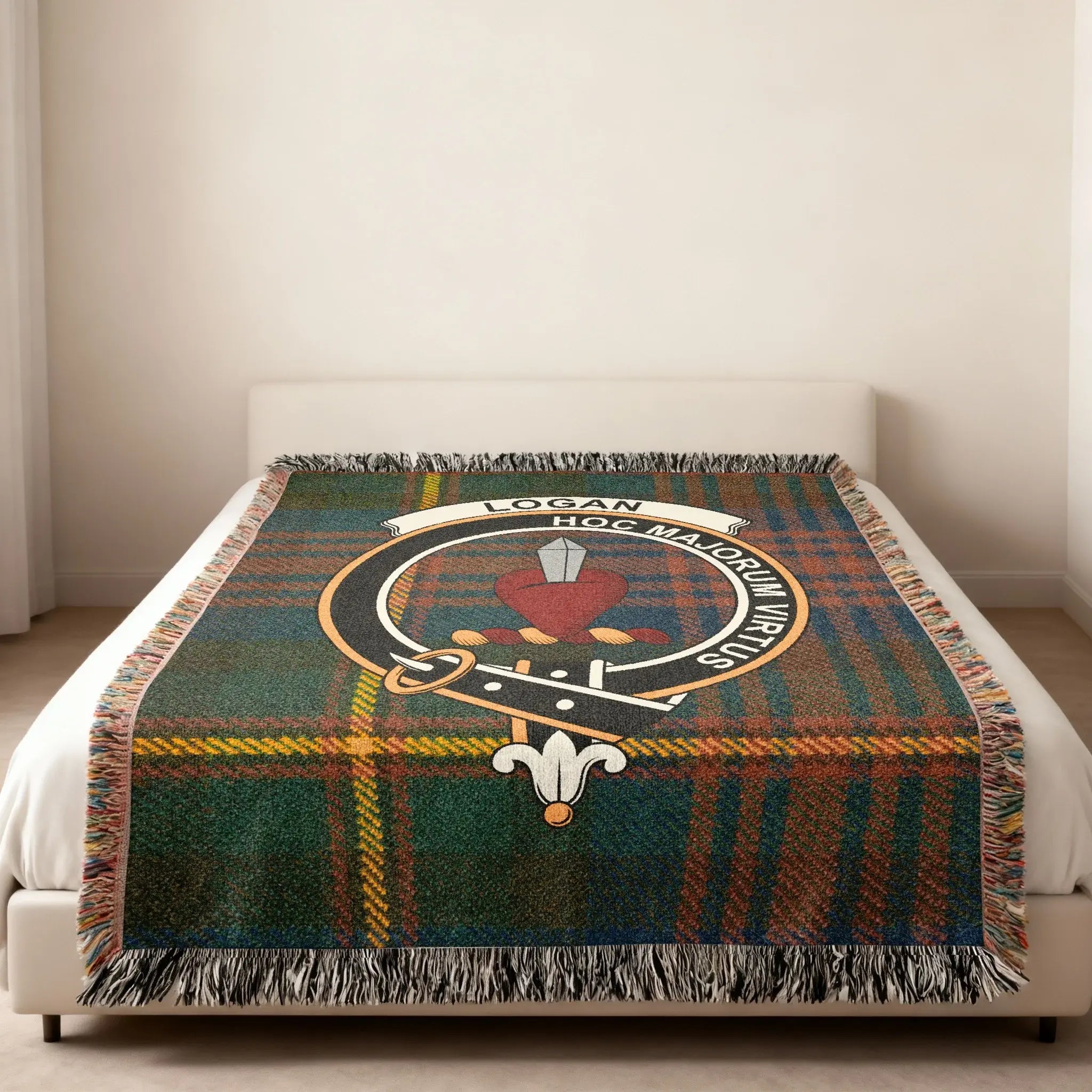 Logan clan tartan crest woven blanket with motto for bedroom decor — fringe edge visible