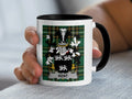 White mug with black handle displaying a green tartan pattern and the "KENT" family crest.