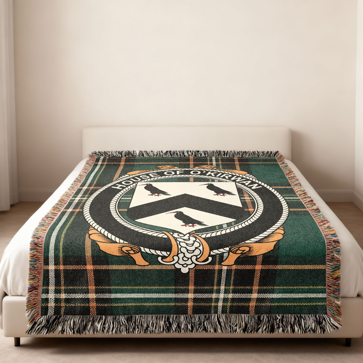 O'Kirwan family crest emblem woven blanket displayed on a bed