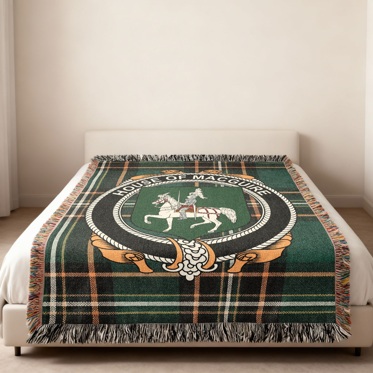 MacGuire family crest emblem woven blanket displayed on a bed