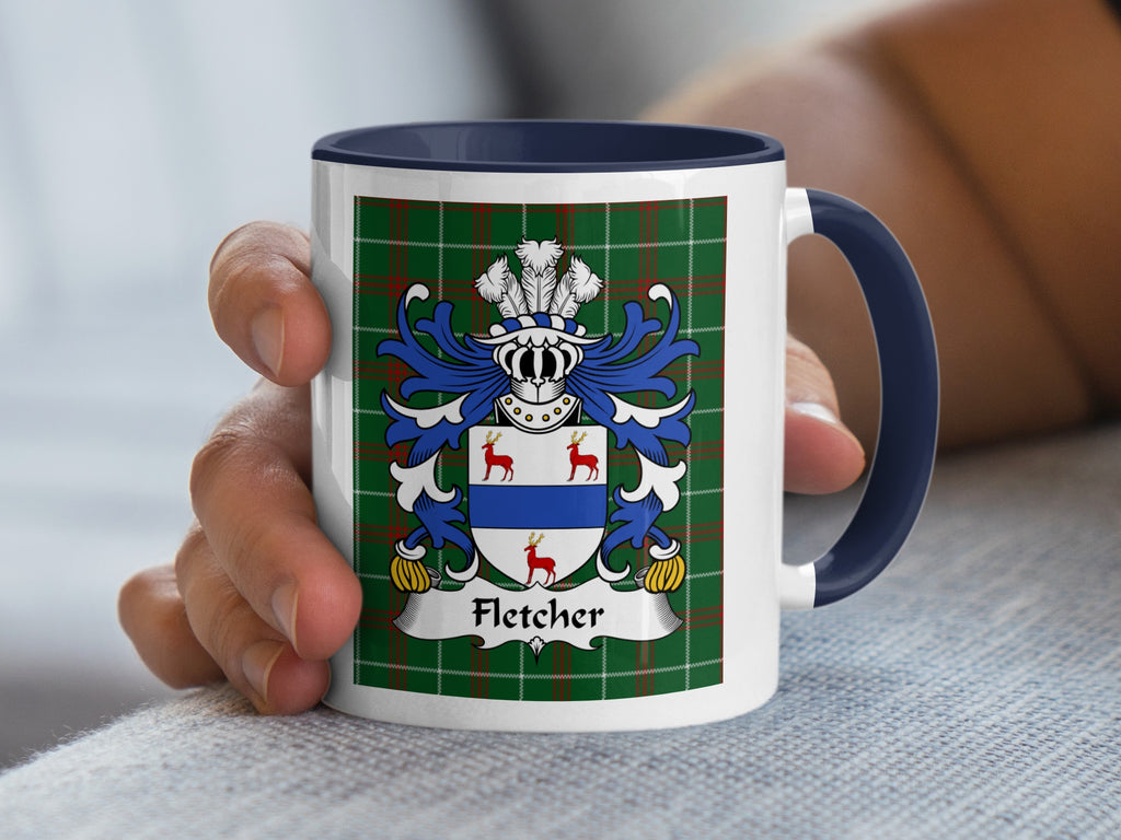 Mug with Fletcher family crest on green tartan background.