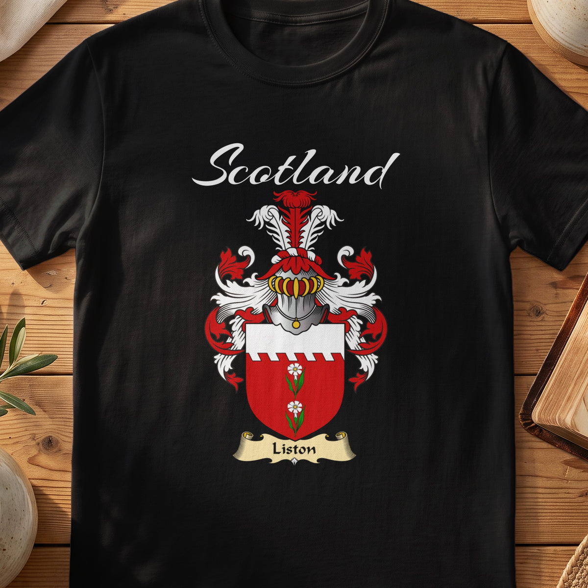 Black Liston Scottish T-shirt featuring a red shield with a white top band and green motif