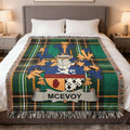 McEvoy tartan blanket with family crest on a bed.
