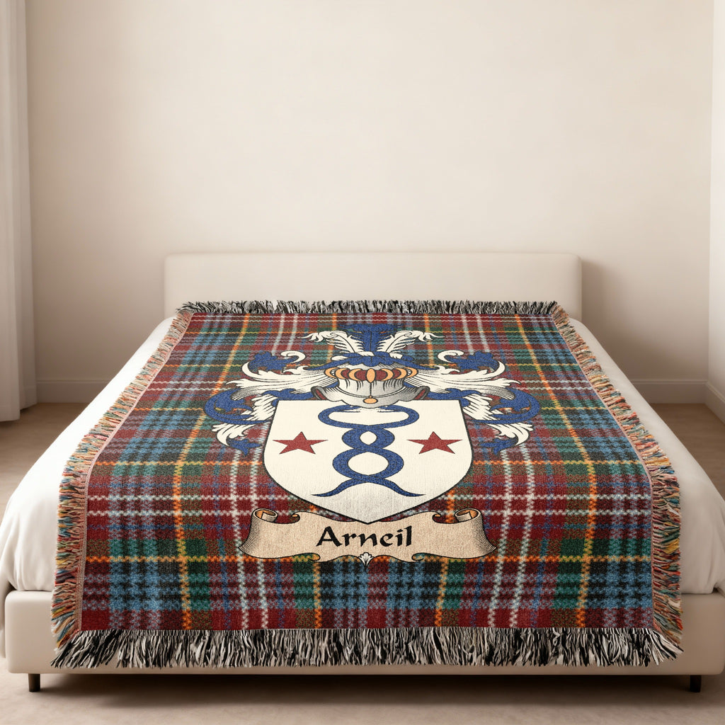 Arneil family crest emblem on a Caledonia tartan woven blanket