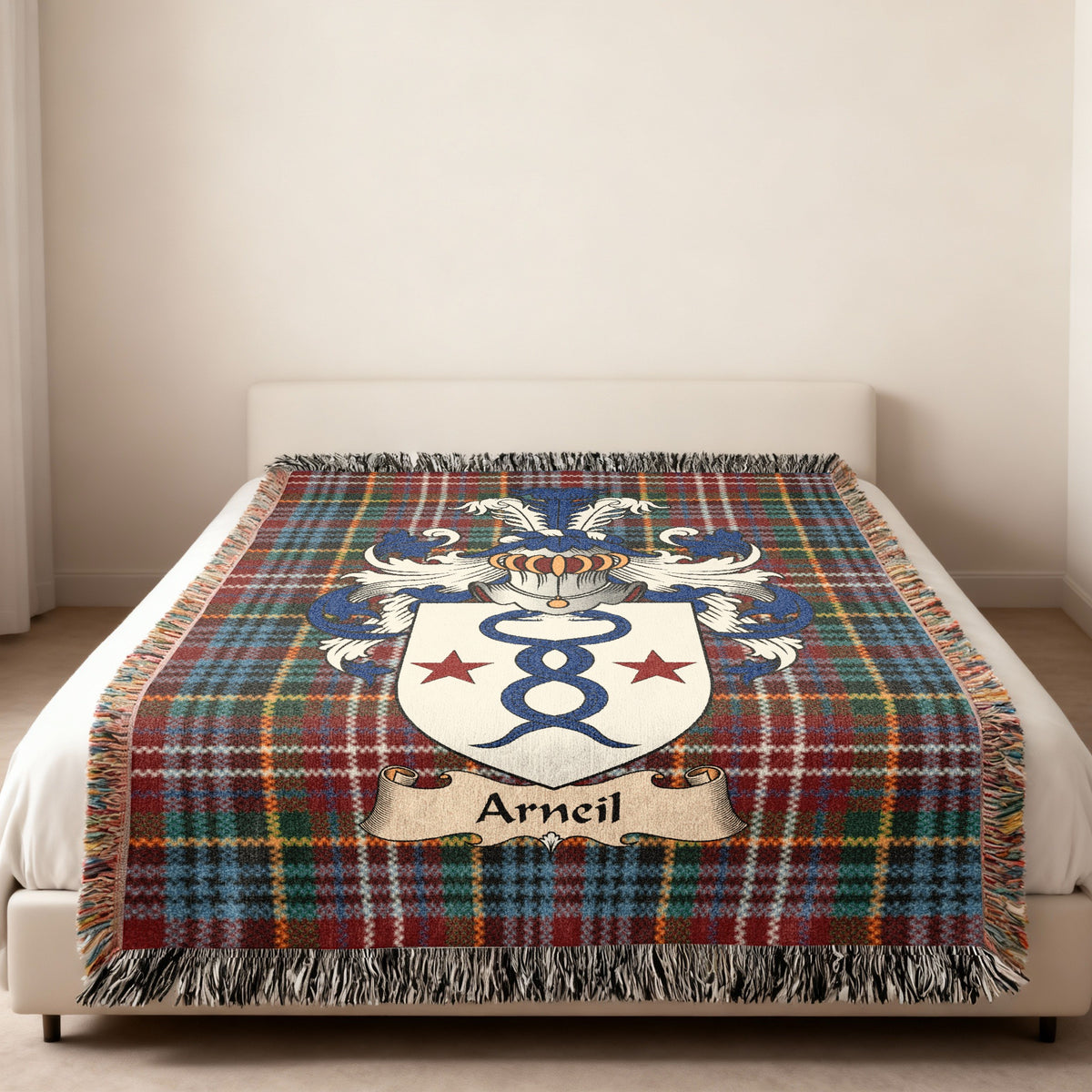 Arneil family crest emblem on a Caledonia tartan woven blanket